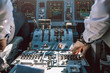 © Santi Nunez/Stocksy - Pilot and copilot inside a cabin flying an airplane