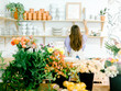 © Kayla Snell/Stocksy - Florist working in her studio