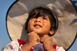 © Dream Lover/Stocksy - Cute little girl wearing hat and looking upwards
