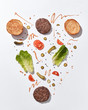 © Yaroslav Danylchenko/Stocksy - Overhead view of burger ingredients