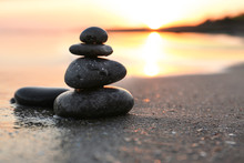 Dark Stones On Sand Near Sea At Sunset, Space For Text. Zen Concept