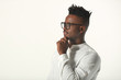 © Alexandr - handsome young african man in glasses and white shirt on a white background