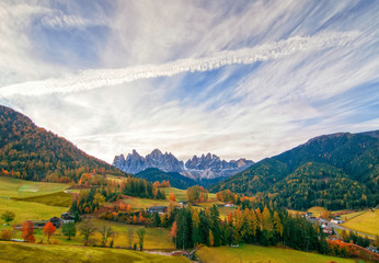 Colorful autumn scenery in Santa Maddalena village at sunny day. Dolomite Alps, South Tyrol, Italy.