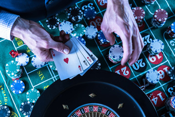 Wall Mural - Roulette table and stack of poker chips. Casino, gambling and entertainment concept.