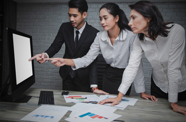 Finance trade manager showing reports screen.Young business crew work with startup project. Modern Desktop computers Blank Screen for advertising text,Product on table or presentation new idea concept