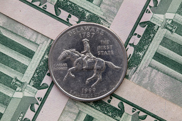 Wall Mural - Symmetric composition of US dollar bills and a quarter of Delaware.