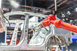 © THINK b - robot arm working in car factory