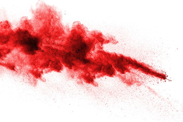 red powder explosion cloud on white background. freeze motion of red color dust particles splashing.