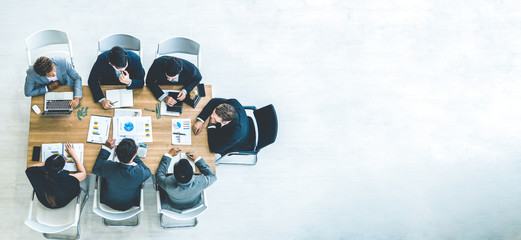 Top view on a group of businessman and businesswoman having a meeting and making a business commitment.