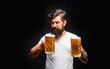 © Svitlana - Celebration oktoberfest festival. Beard man drinking beer from mug. Young man tasting draft beer. Lager and dark ale. Beer time. Bearded man holds beer glass. Handsome man drinks ale at bar or pub.