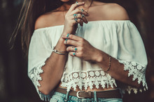 Beautiful Fashionable Boho Chic Woman In A White Short Blouse With Silver Turquoise Jewelry. Boho Fashion. Stylish Girl With Silver Rings Using Hippie Style.