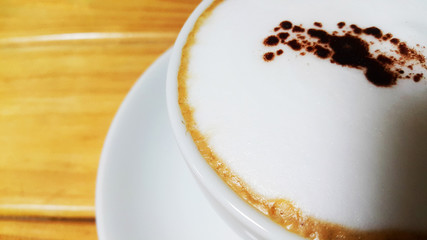 Close up of Milk foam with cappuccino hot coffee backgrounds