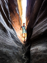 A Young Woman Poses In Little Wild Horse Canyon