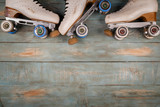 artistic roller skates on a wood background
