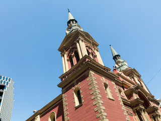 Wall Mural - The Basilica de la Merced, with its two pointed domes and intense red color. Built in 1566, it was rebuilt in 1760 after a major earthquake. Santiago of Chile