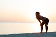 © marjan4782 - Young woman catching a breath after a run on the beach