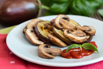 Wall Mural - Grilled eggplant slices layered with mushrooms.