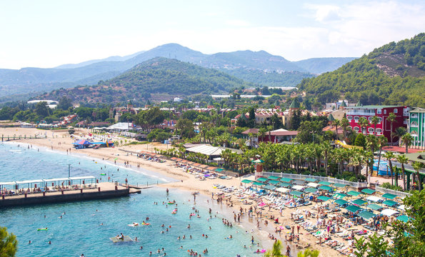 sunny alanya beach in turkey with sea view. konakli old town view from the fortress on the mountain.