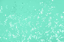 White And Green Stars Scattering On Mint Background.
