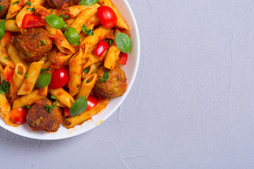 Canvas Print - Italian penne pasta with meatballs and tomatoes