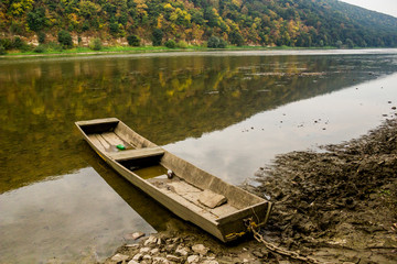 lonely wooden boat on the river