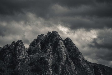 mysterious black mountain with dramatic cloudy sky