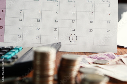 Cuadros en Lienzo debt collection and tax season concept with deadline calendar,coins,calculator o