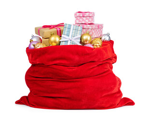 Santa Claus red bag full of Christmas boxes with gifts and toys, isolated on white background. File contains a path to isolation.