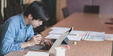 Wall Mural - professional male ui web developer working on his project about ux template