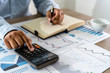 © onephoto - businessman working using a calculator finance accounting concept achievement to balance man assistant accounting