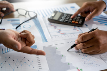 Wall Mural - businessman working using a calculator finance accounting concept achievement to balance man assistant accounting