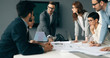 © NDABCREATIVITY - Business colleagues in conference room