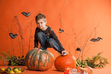 little boy with halloween pumpkin
