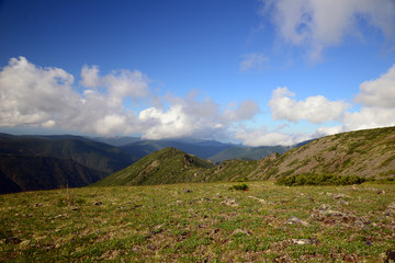  The mountain ranges of Satan and Hamar-Daban. Mountain peaks and valleys. Mountain landscape. The nature of Siberia.