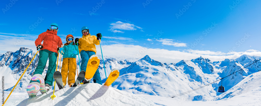 Ski in winter season, mountains and ski touring equipments on the top in sunny day in France, Alps above the clouds. - obrazy, fototapety, plakaty 