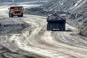 Wall Mural - Rock transportation by dump trucks.