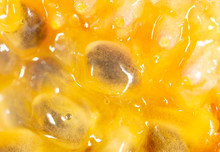 Juicy Passion Fruit Pulp As A Background
