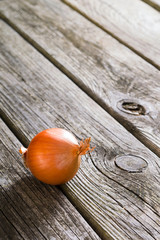 Wall Mural - onion on old wooden table background