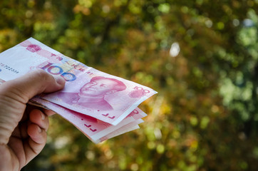 yuan in the hand. Chinese money close-up.