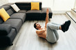 © Diego Cervo - Adult Man Training ABS Muscles At Home Doing One Arm Crunches