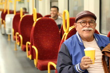 Senior Hispanic Man Using Public Transportation