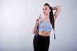 © AS Photo Family - Cheerful attractive young fitness woman in top and black leggings with jump rope and bottle of water isolated over white background.