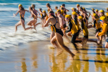 Nippers Competitors Running Into The Ocean In Surf Lifesaving Beach Swimming Event, Australia