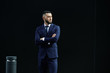 © amixstudio - portrait of asian kazakh businessman in a suit on a black background