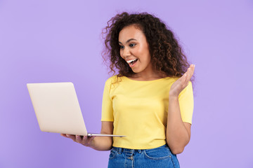 Sticker - Image of excited african american woman holding laptop computer