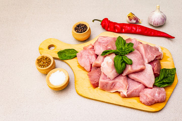 Raw pork neck, cut into pieces with fresh vegetables and dry spice