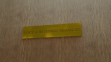 golden door sign Food & beverage manager. enter to room