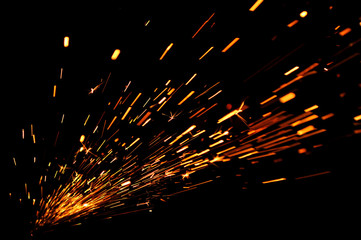 glowing flow of sparks in the dark