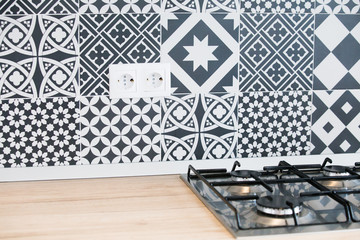 Modern geometric black and white kitchen tiles