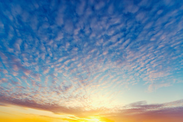 Colorful clouds after rain at sunset time.